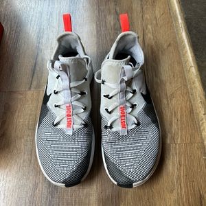 Woman’s Nike free TR 8 black, and white shoe with orange detail size 9
